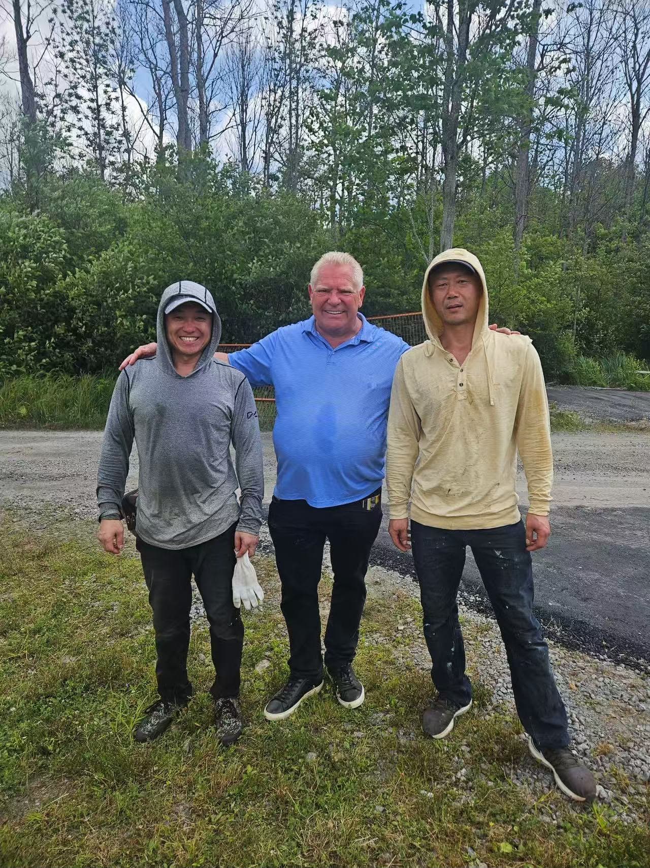 Ontario Premier Doug Ford with the Tomato Roofing crew